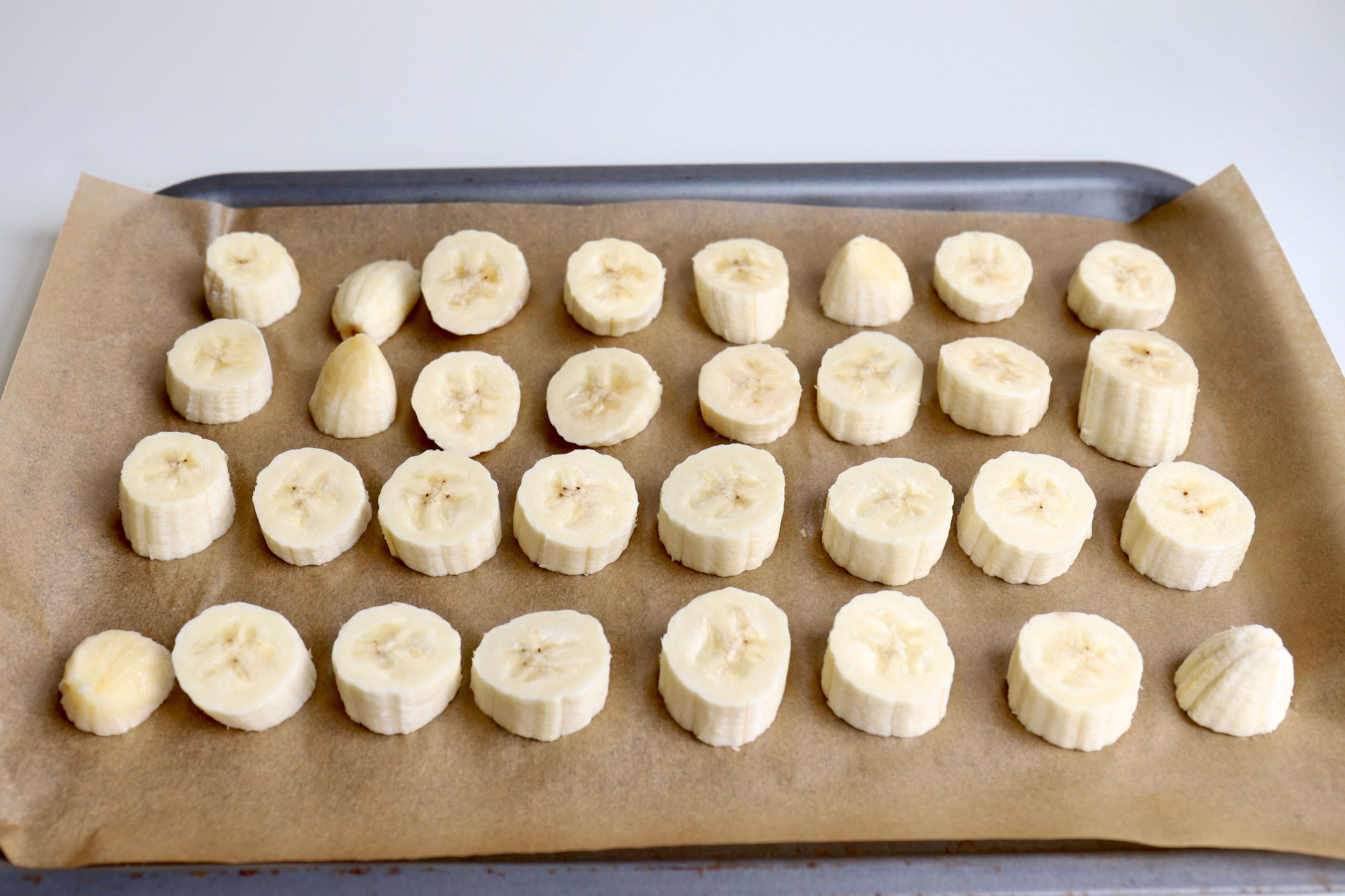 frozen banana pieces on a baking sheet