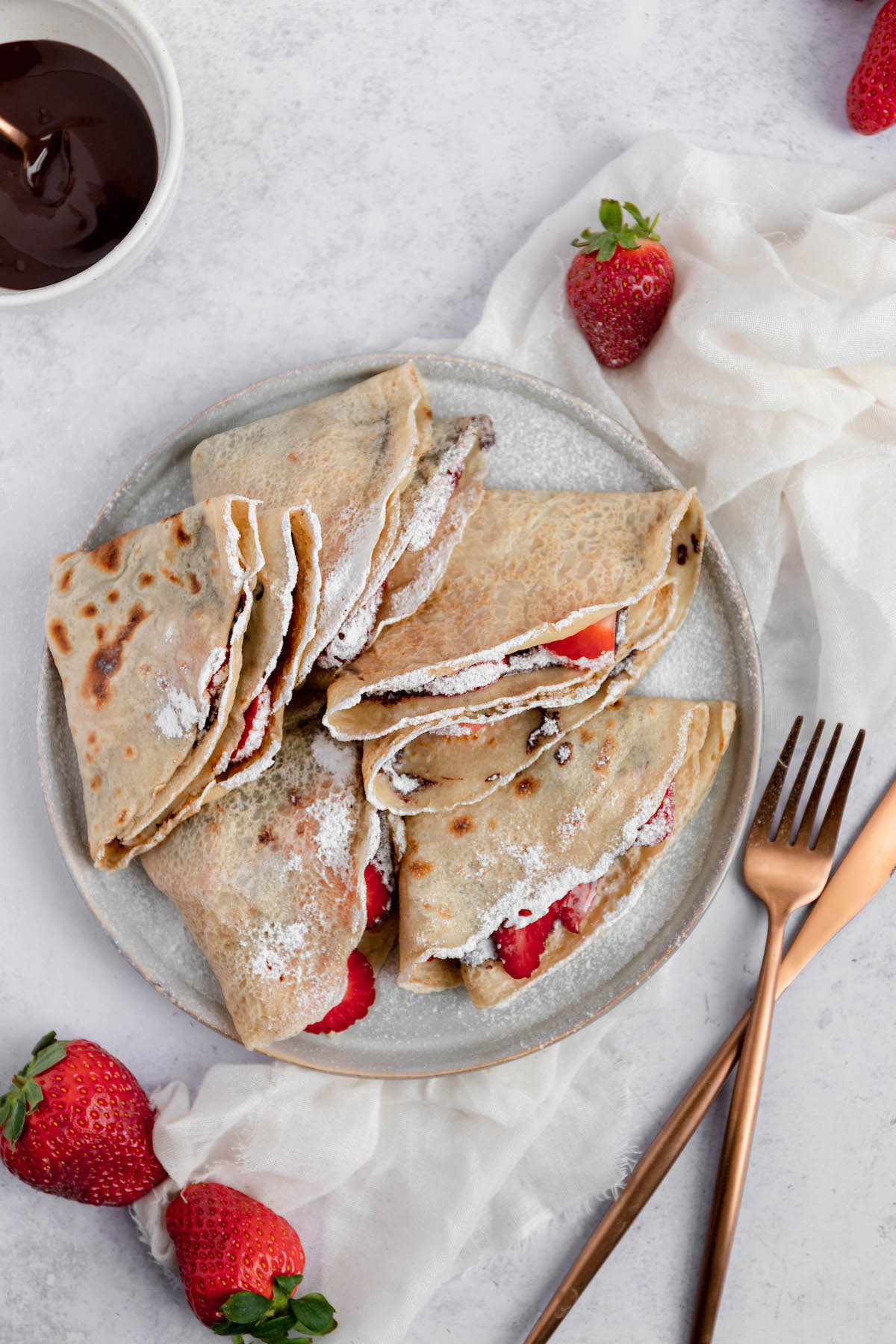 These 3-ingredient vegan crepes are the easiest sweet French treat you’ve ever tried. This egg-free crepe recipe is also low in fat, cholesterol-free and meat-eater approved. #vegan #crepes #dessert