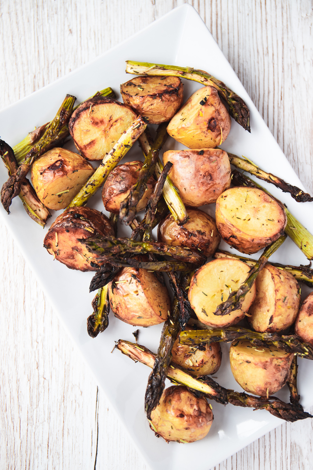 Balsamic roasted potatoes and asparagus on a plate