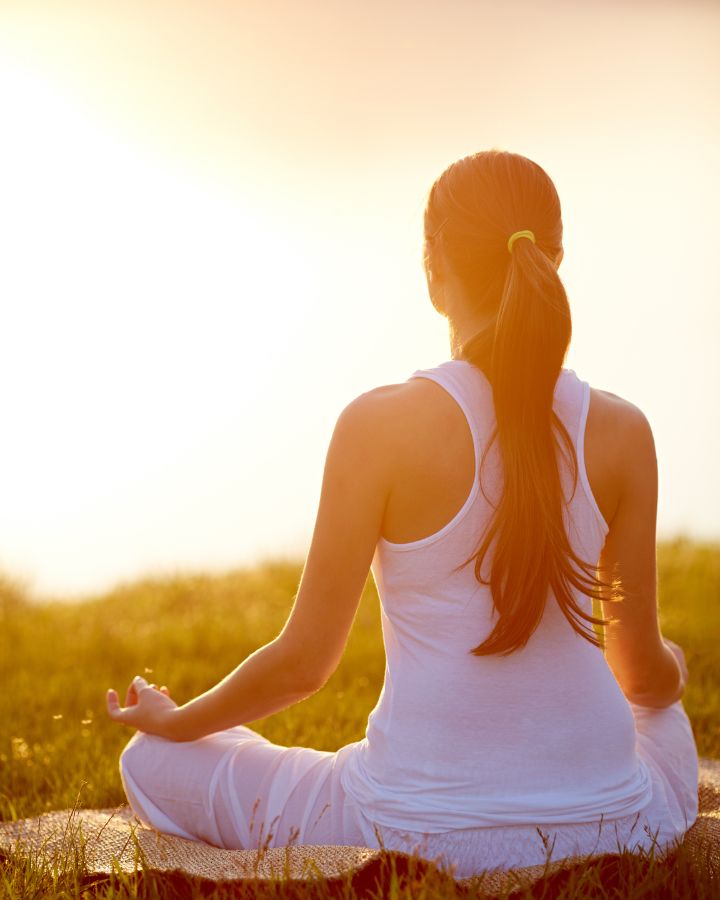 woman meditating in nature