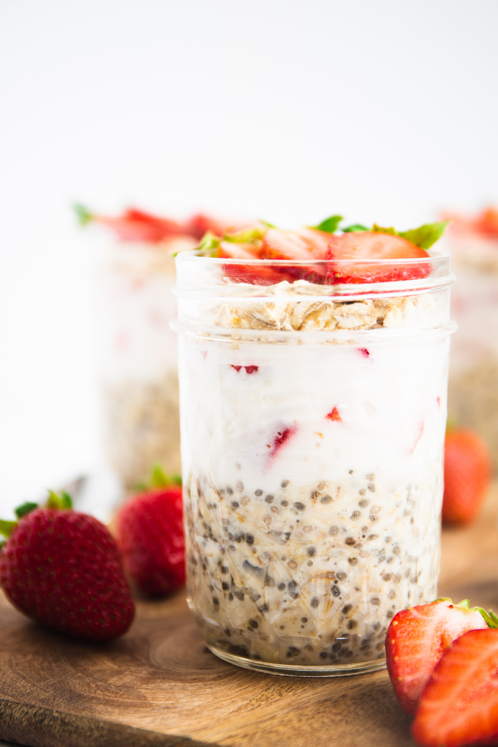 layers of overnight oats and strawberries in a jar