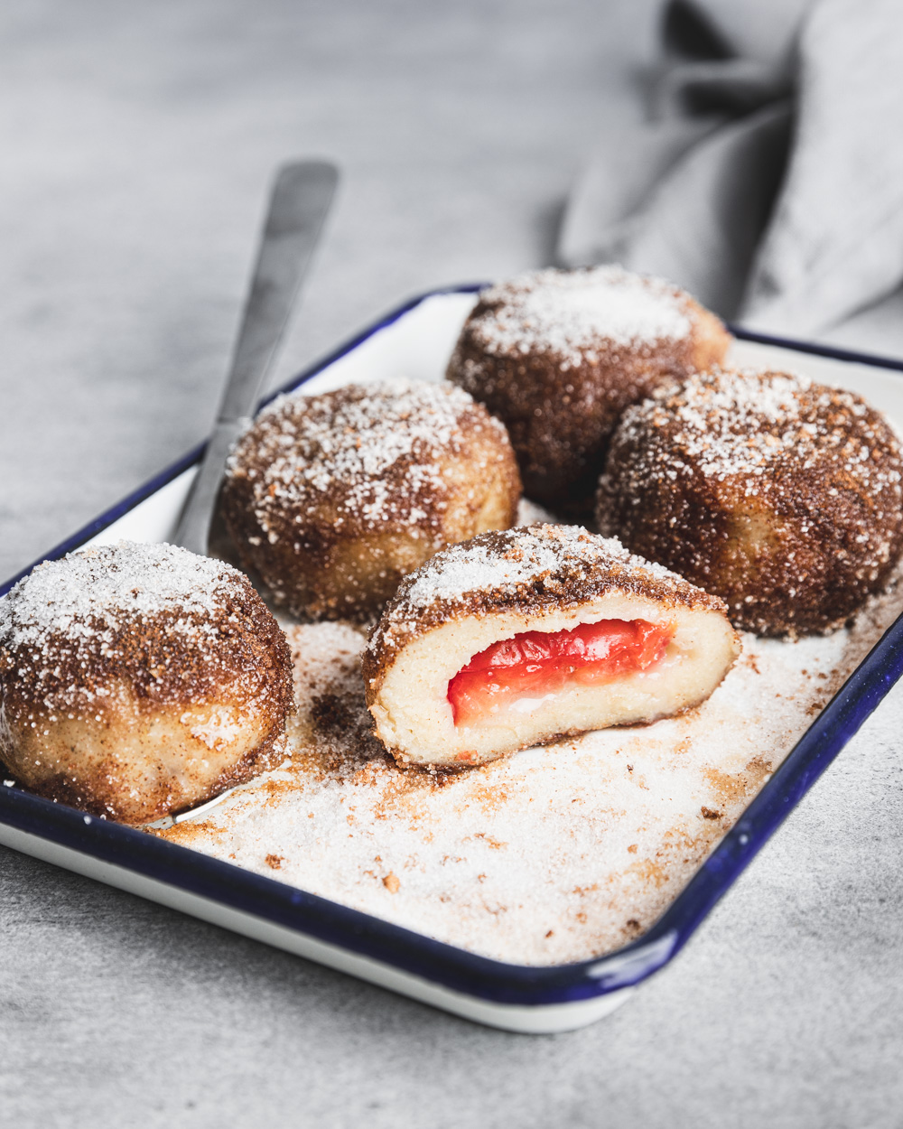 Plum Dumplings Coated in Sugar and Cinnamon